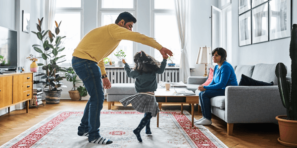 A father playing with his daughter