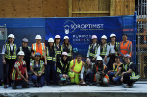 Soroptimist House & Purpose Driven Development teams in construction gear at the construction site of Soroptimist House Vancouver