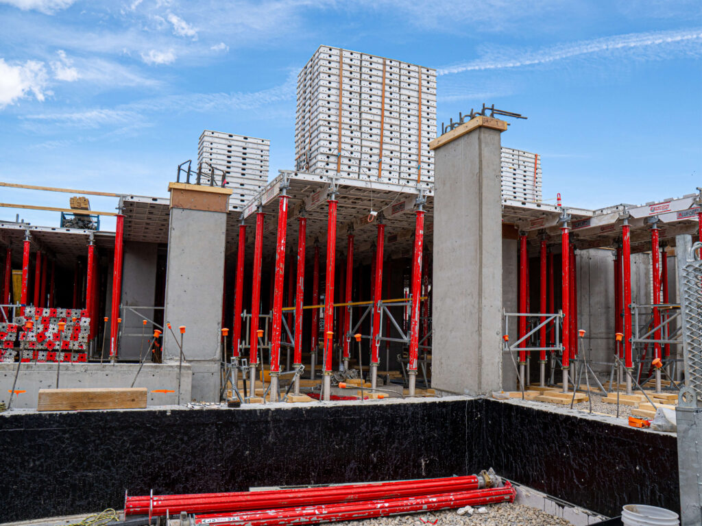 Image of construction of A New Home for Families, featuring the foundation and initial building structure.
